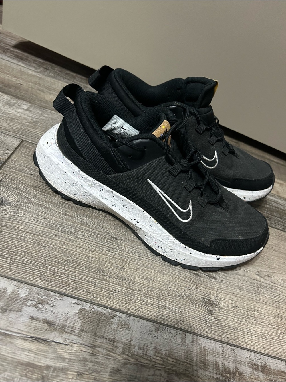 black and white Nike Crater Remixa sneakers speckled soles